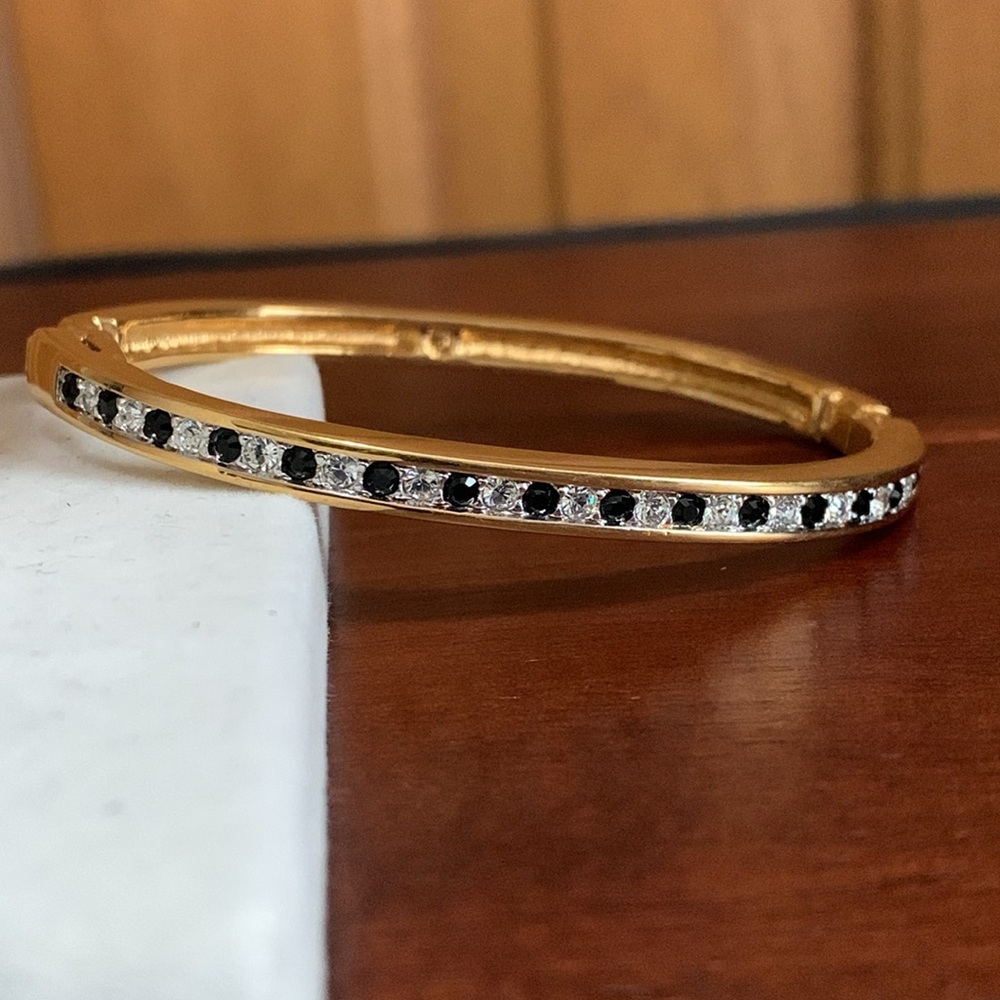 Swarovski gold tone clear and black crystal hinge bracelet